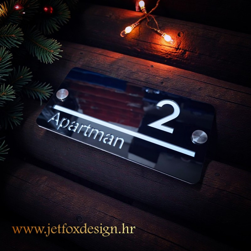 Moderni kućni broj s prezimenom izrađen od kvalitetnog akrila za luksuzan izgled ulaza. Želite personalizirani kućni broj s prezimenom?
