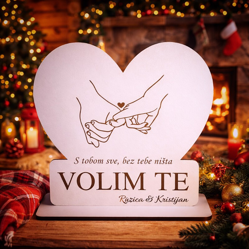 Što pokloniti voljenoj osobi? Dekoracija u obliku srca s motivom isprepletenih ruku, natpisom Volim te i imenima po želji.